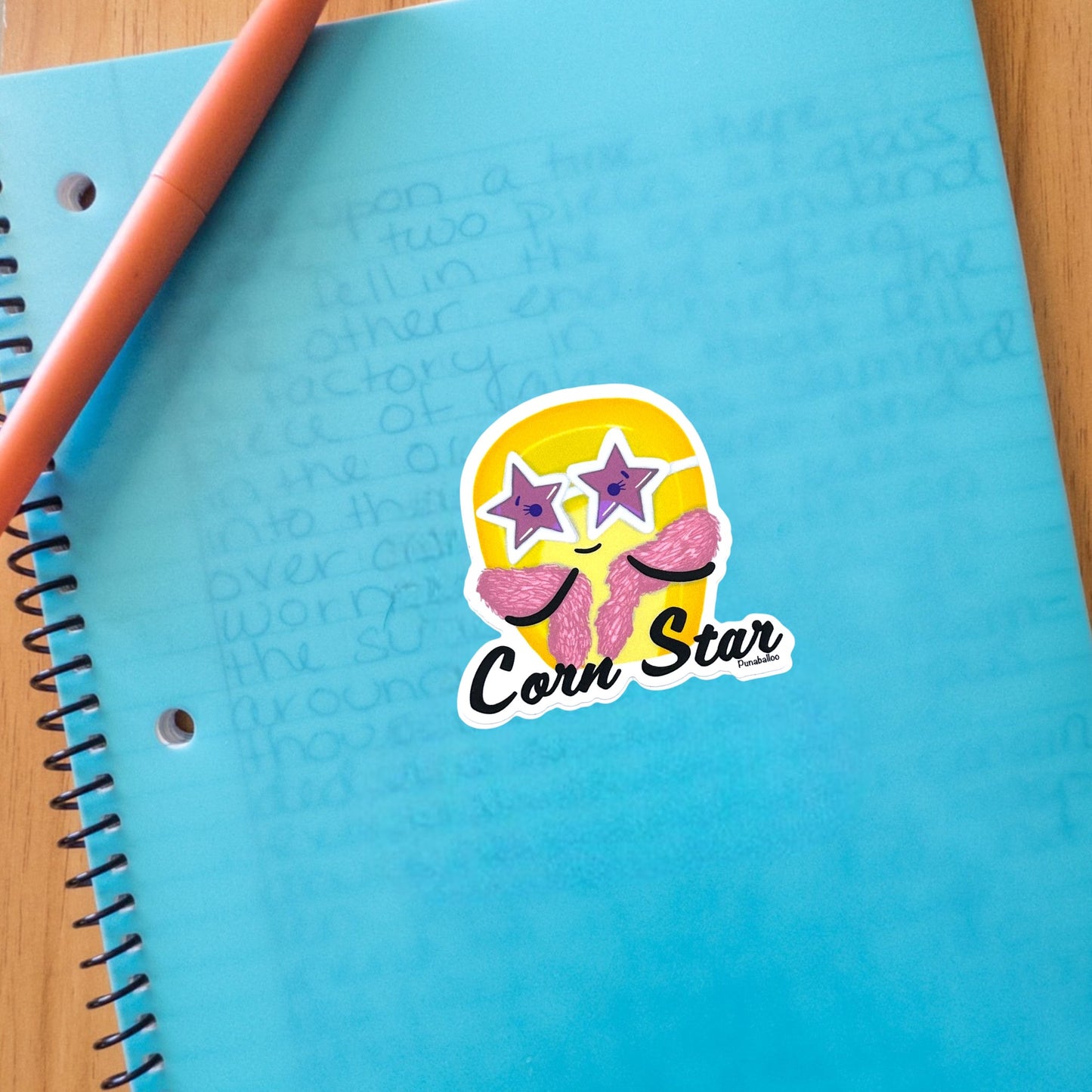 “Corn Star” corn sticker — hand-drawn food pun design by Punaballoo, waterproof vinyl decal for snack lovers and humor fans.