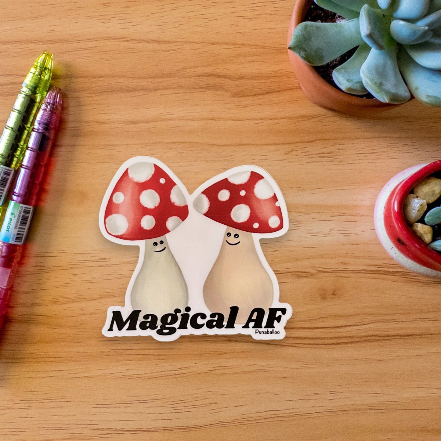 “Magical AF” mushroom sticker — hand-drawn mystical forest pun design by Punaballoo, waterproof vinyl decal for trippy humor and magic lovers.