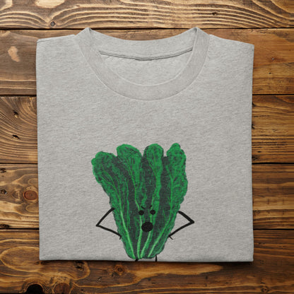A folded light heather gray t-shirt with Oh Kale No pun printed on the front, displayed flat on a rustic wooden plank background.