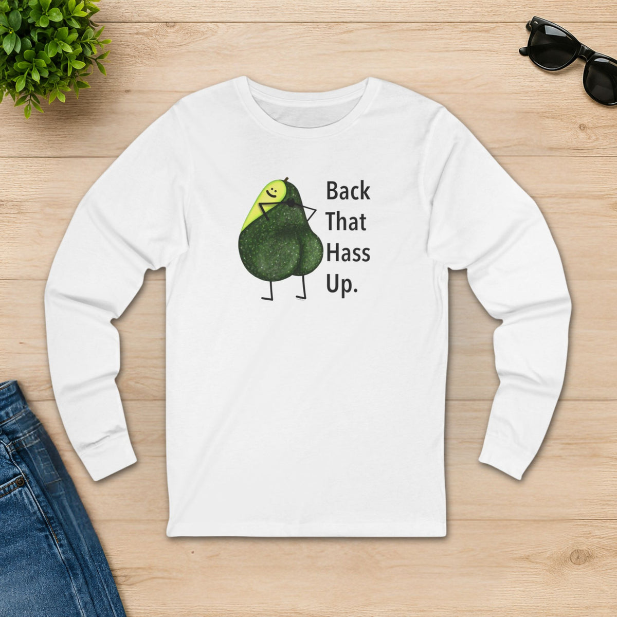 White Back That Hass Up long sleeve shirt displayed flat on a wooden background
