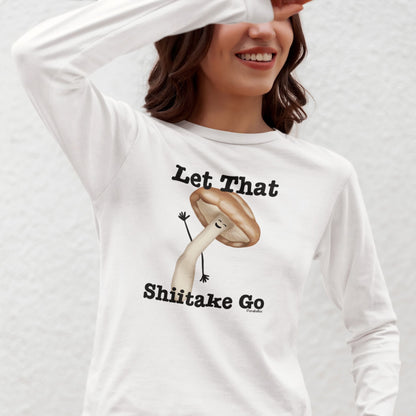 Woman wearing a white Let That Shiitake Go long sleeve shirt with a waving mushroom design