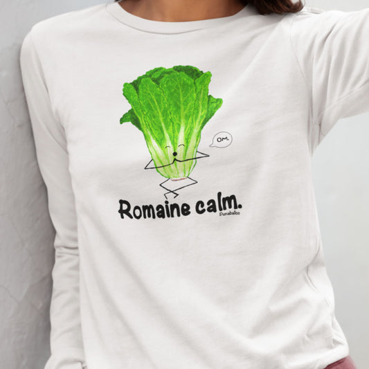 Close up of a person wearing a white Romaine Calm long sleeve shirt with meditating lettuce design