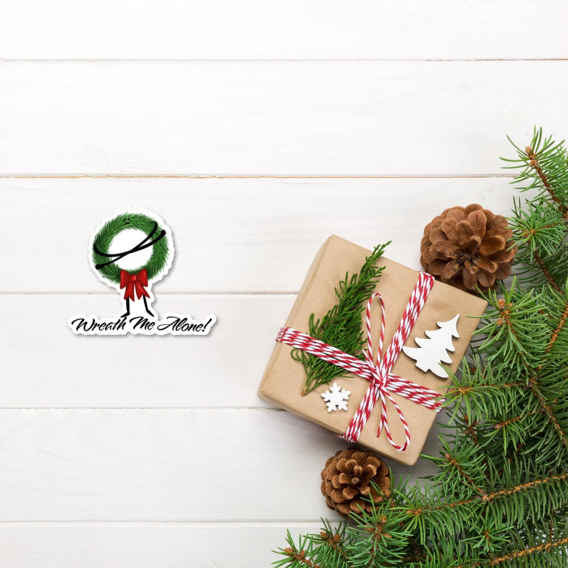 Wreath Me Alone sticker — hand-drawn grumpy Christmas wreath pun design, waterproof vinyl decal.