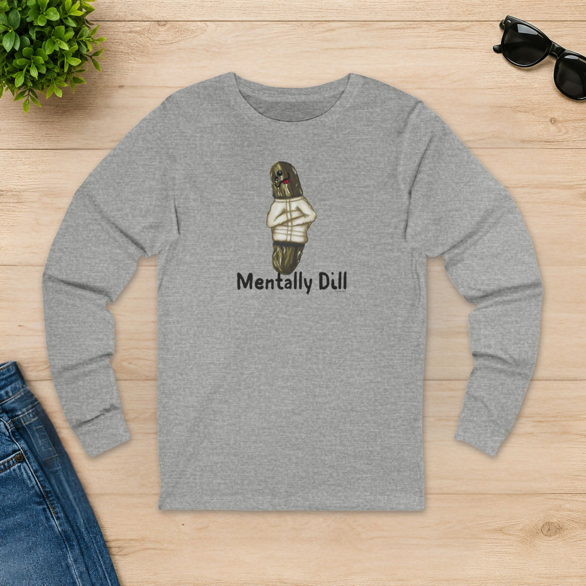 Athletic heather Mentally Dill pickle long sleeve shirt laid flat on a wooden table