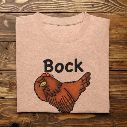 Folded heather peach Bock My Life chicken t-shirt mockup on wood background
