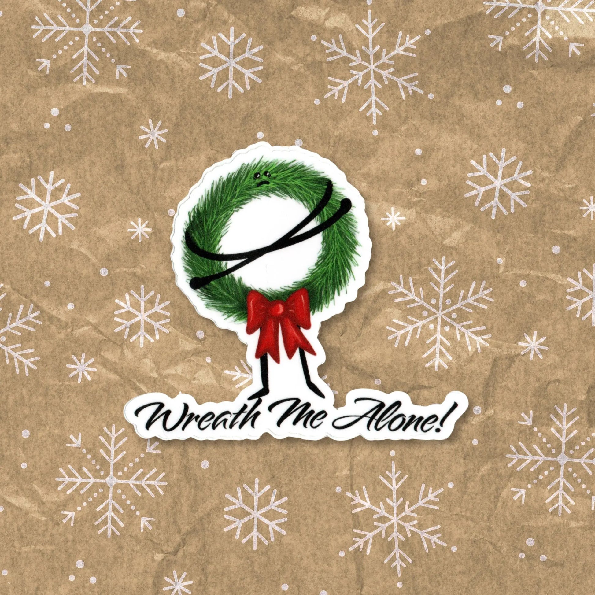Wreath Me Alone sticker — hand-drawn grumpy Christmas wreath pun design, waterproof vinyl decal.