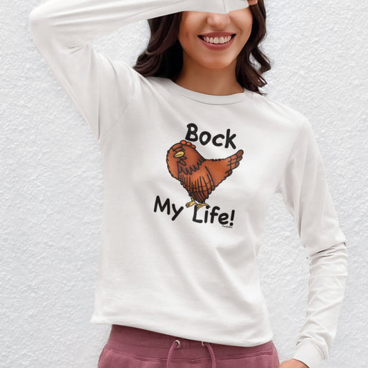 Woman wearing a white Bock My Life long sleeve shirt with an exasperated chicken design