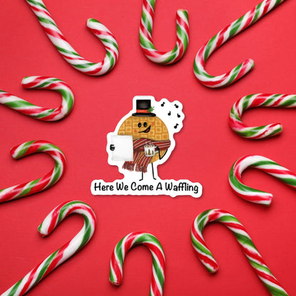 Here We Come A-Waffling sticker — hand-drawn Christmas waffle caroler pun design, waterproof vinyl decal.