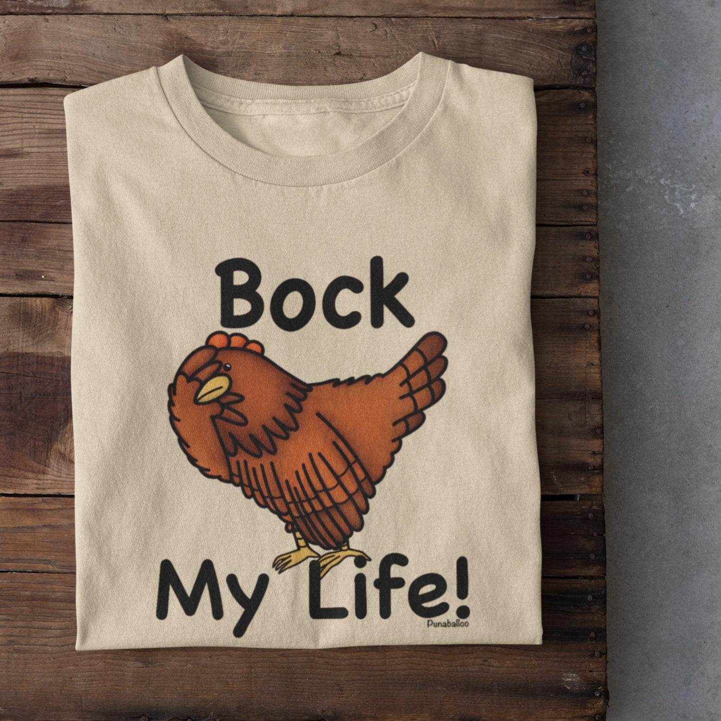 Soft Cream t-shirt with a cartoon chicken and text 'Bock My Life!' on a wooden surface