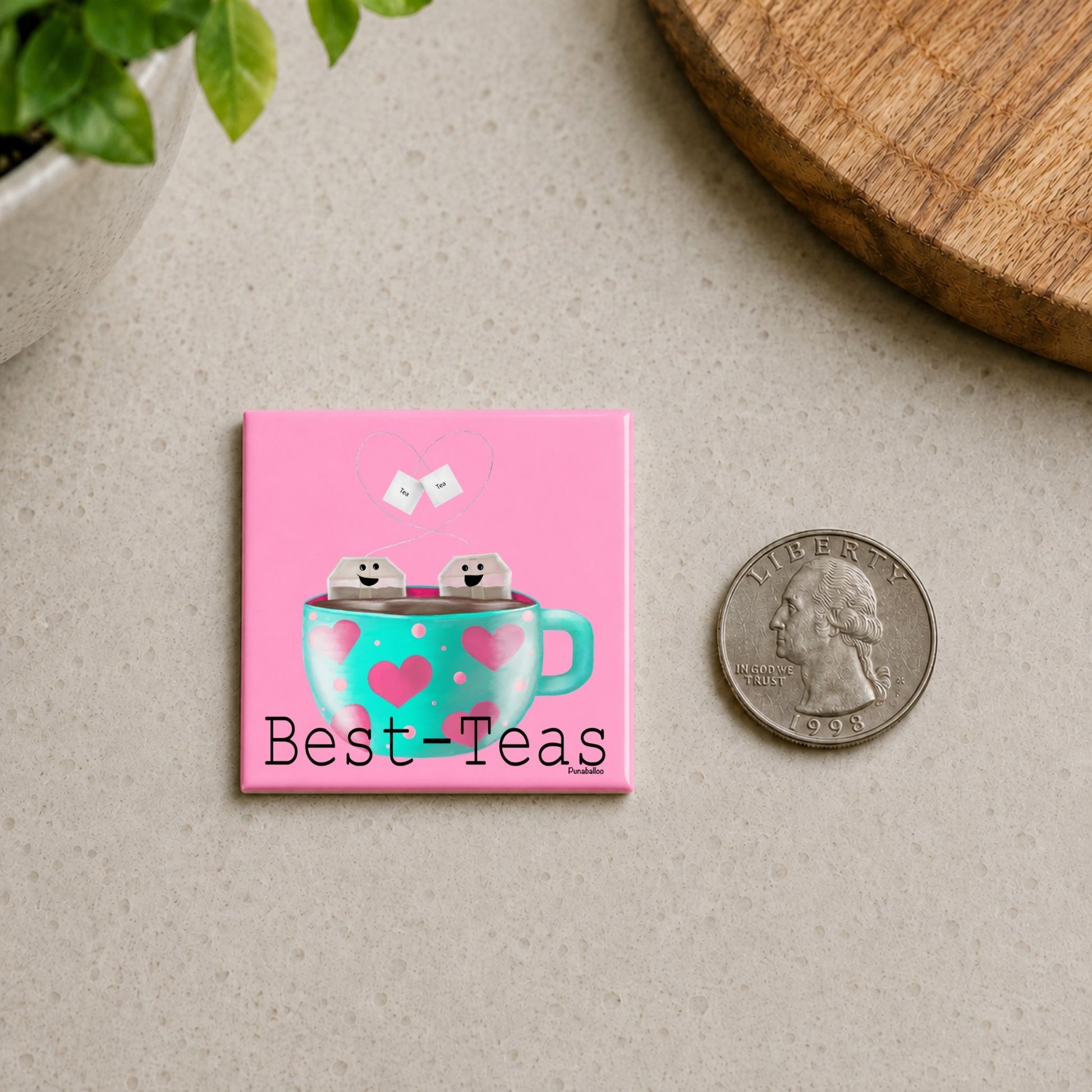 Best-Teas tea pun magnet on a countertop beside a quarter for size