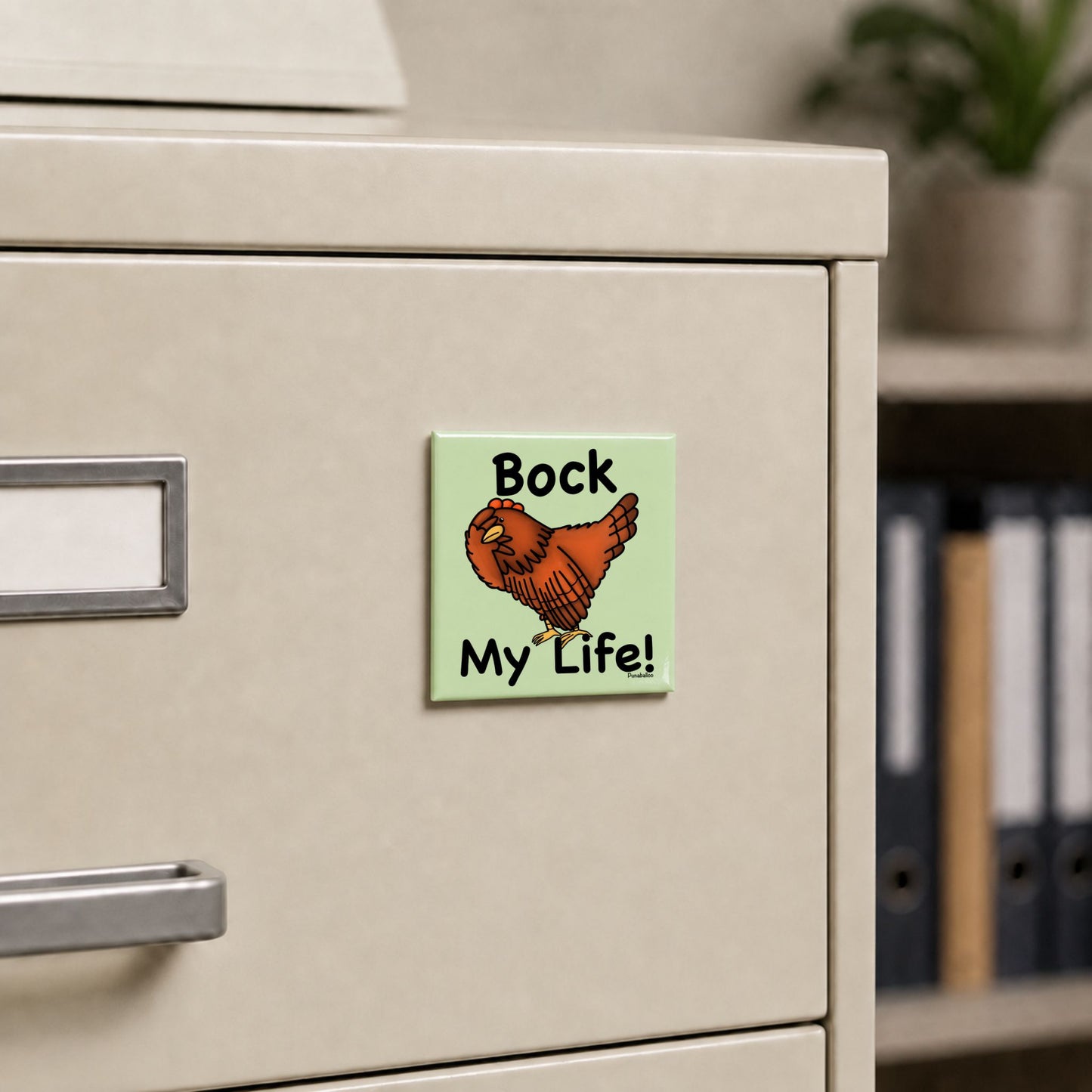 Bock My Life chicken pun magnet on a cream file cabinet