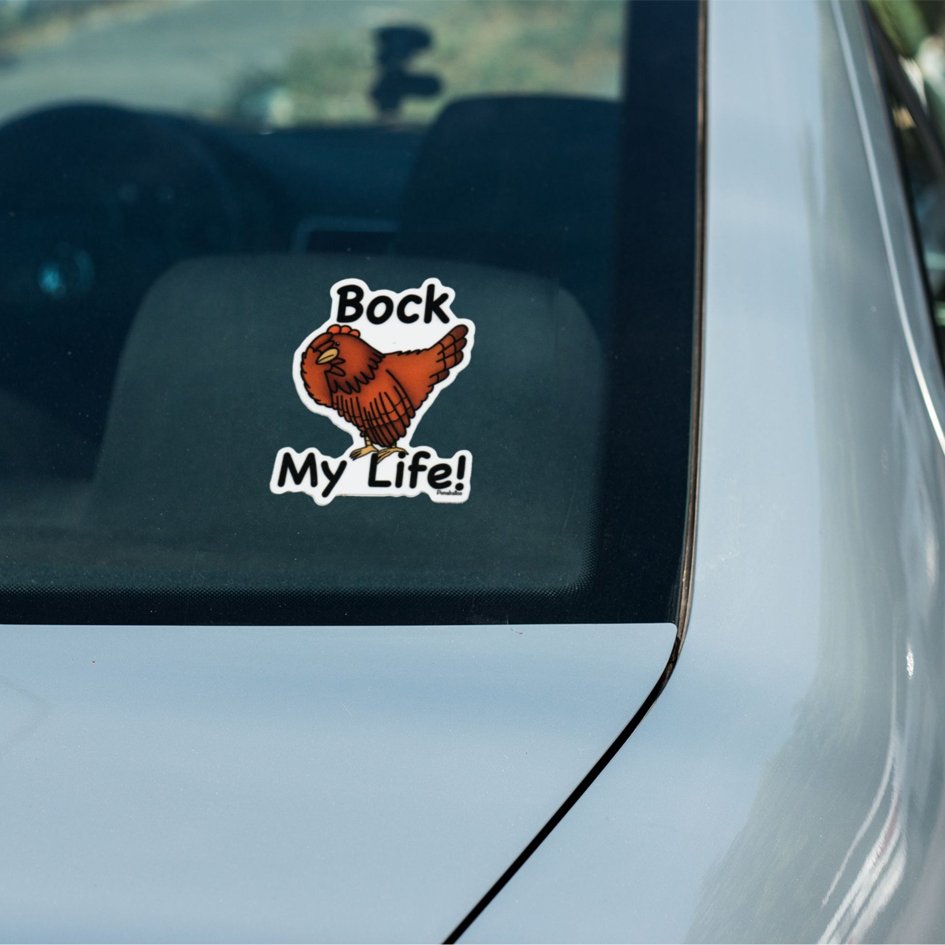 Bock My Life chicken sticker on a car window