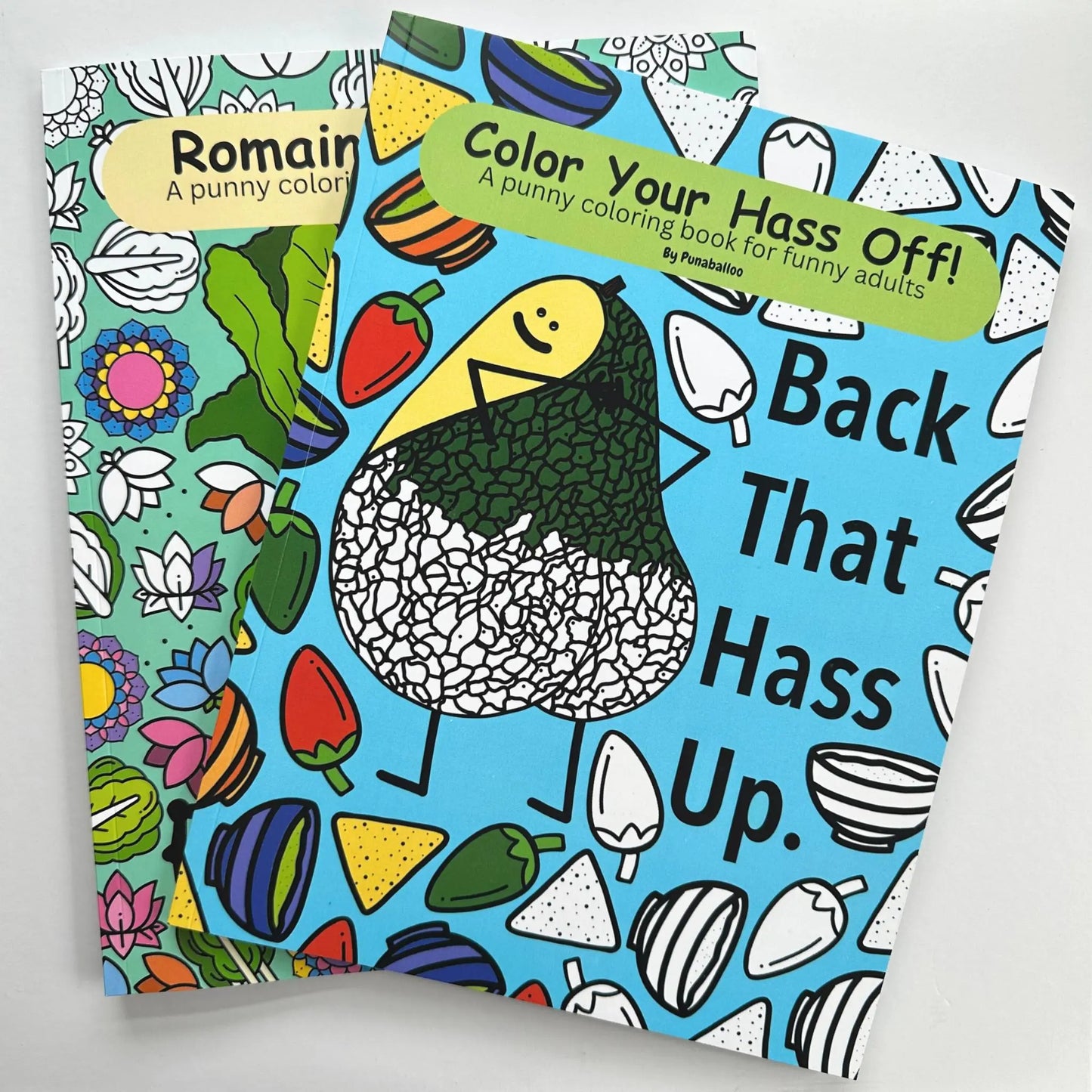 Color Your Hass Off and Romaine Colorful funny food pun adult coloring books stacked together