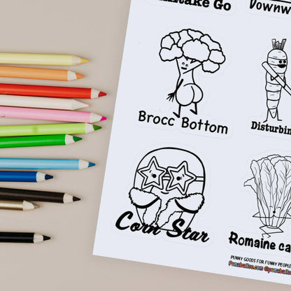 Close up Color-your-own funny food pun sticker sheet with pencils on beige background