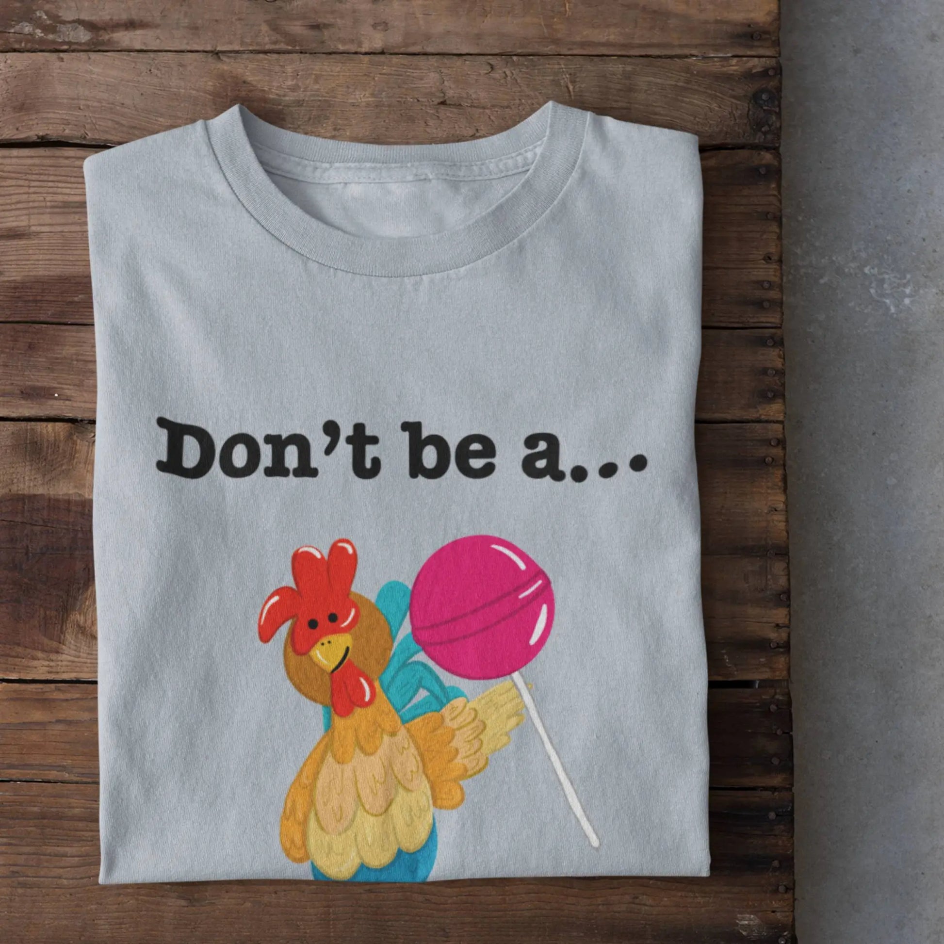 Don’t Be a Cock Sucker funny poultry shirt flat lay light blue