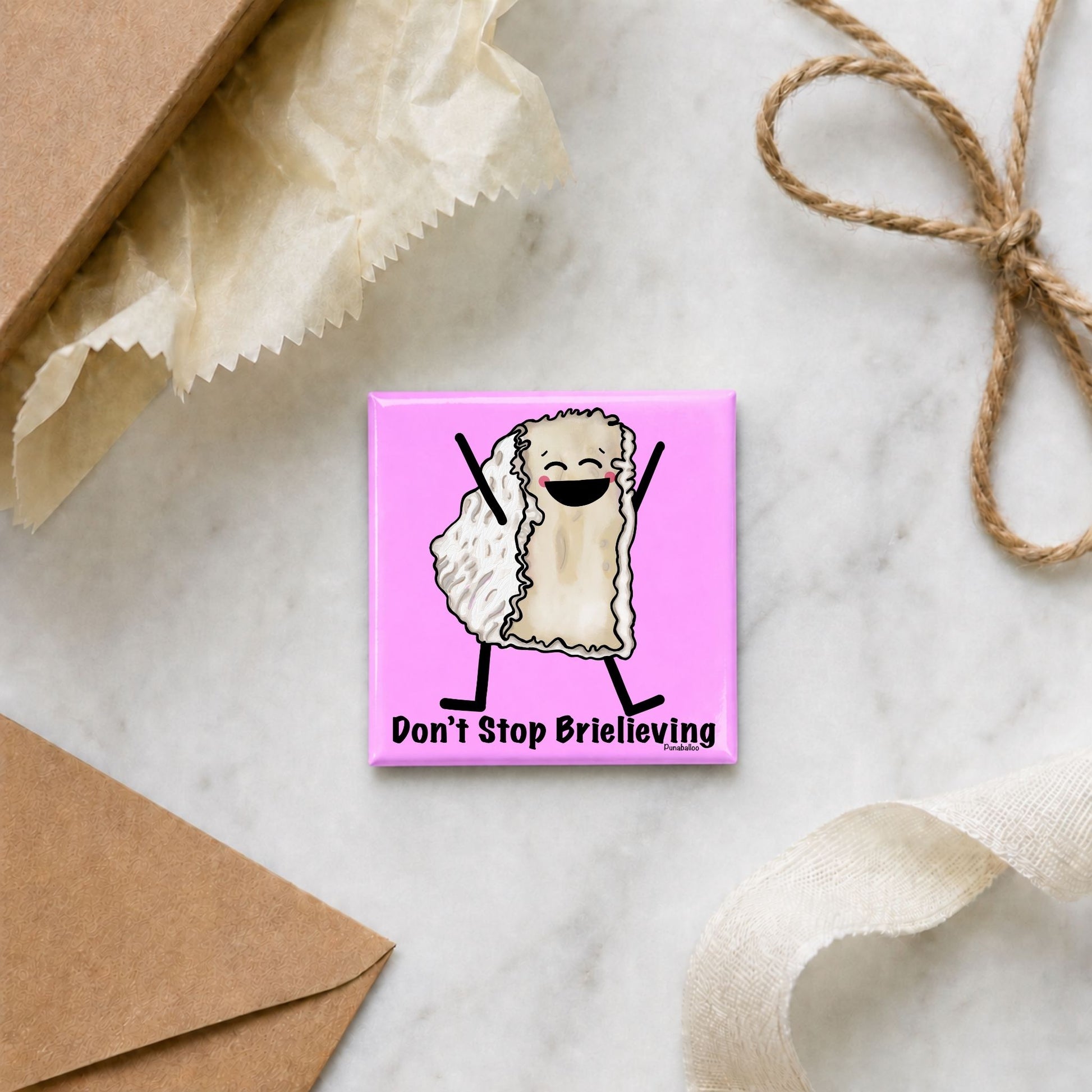 Don’t Stop Brielieving funny cheese magnet in a gift flat lay