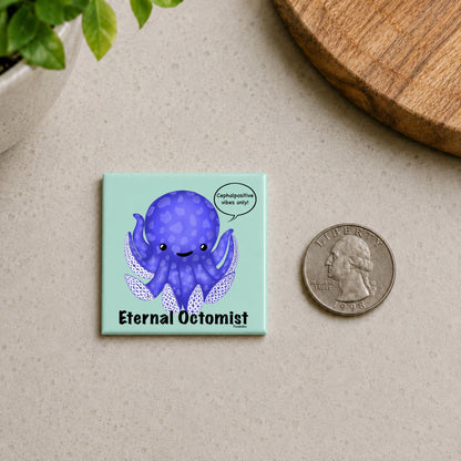 Eternal Octomist octopus magnet on a countertop beside a quarter for size