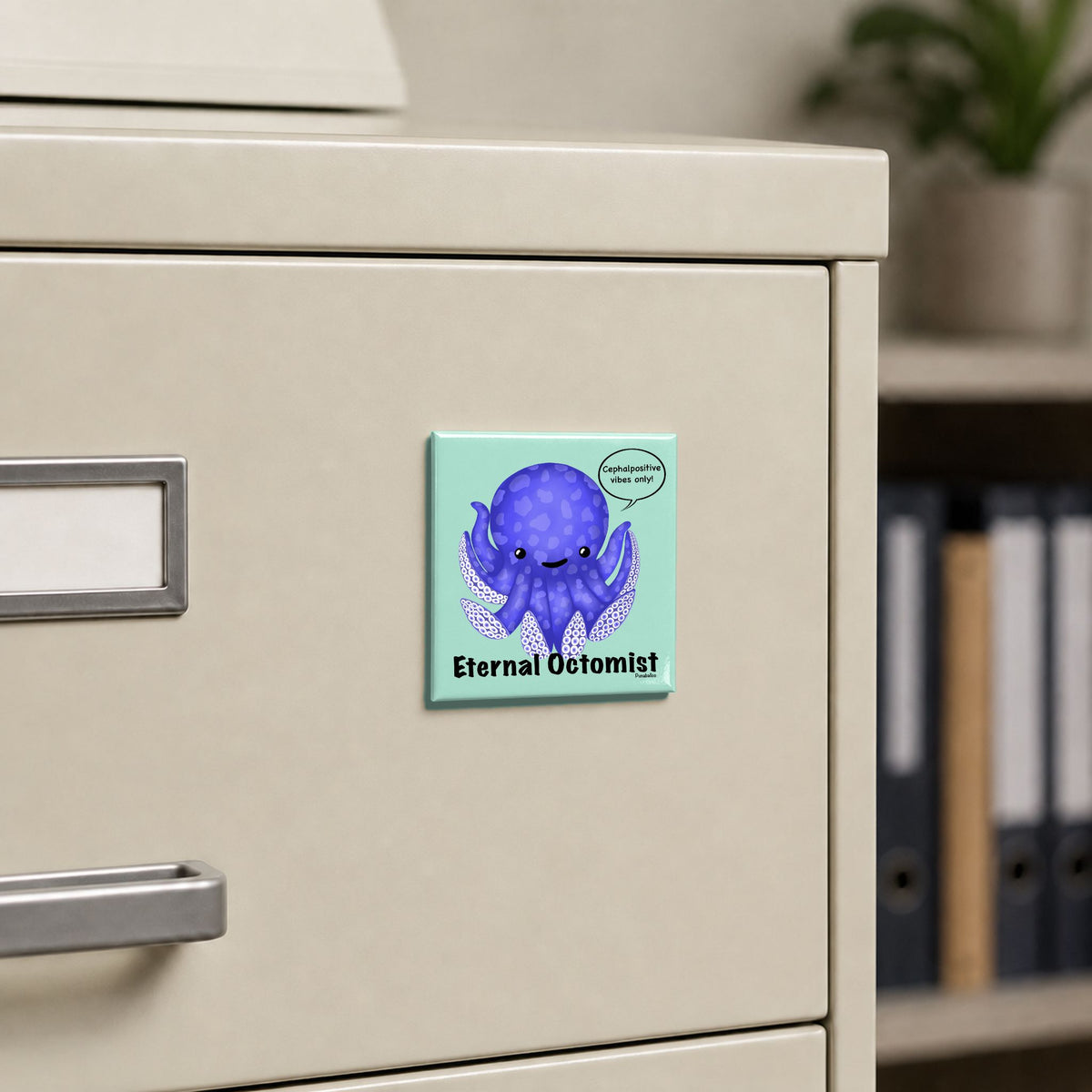 Eternal Octomist octopus pun magnet on a cream file cabinet