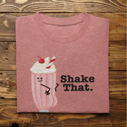 Folded heather mauve Shake That funny milkshake shirt on rustic wood background
