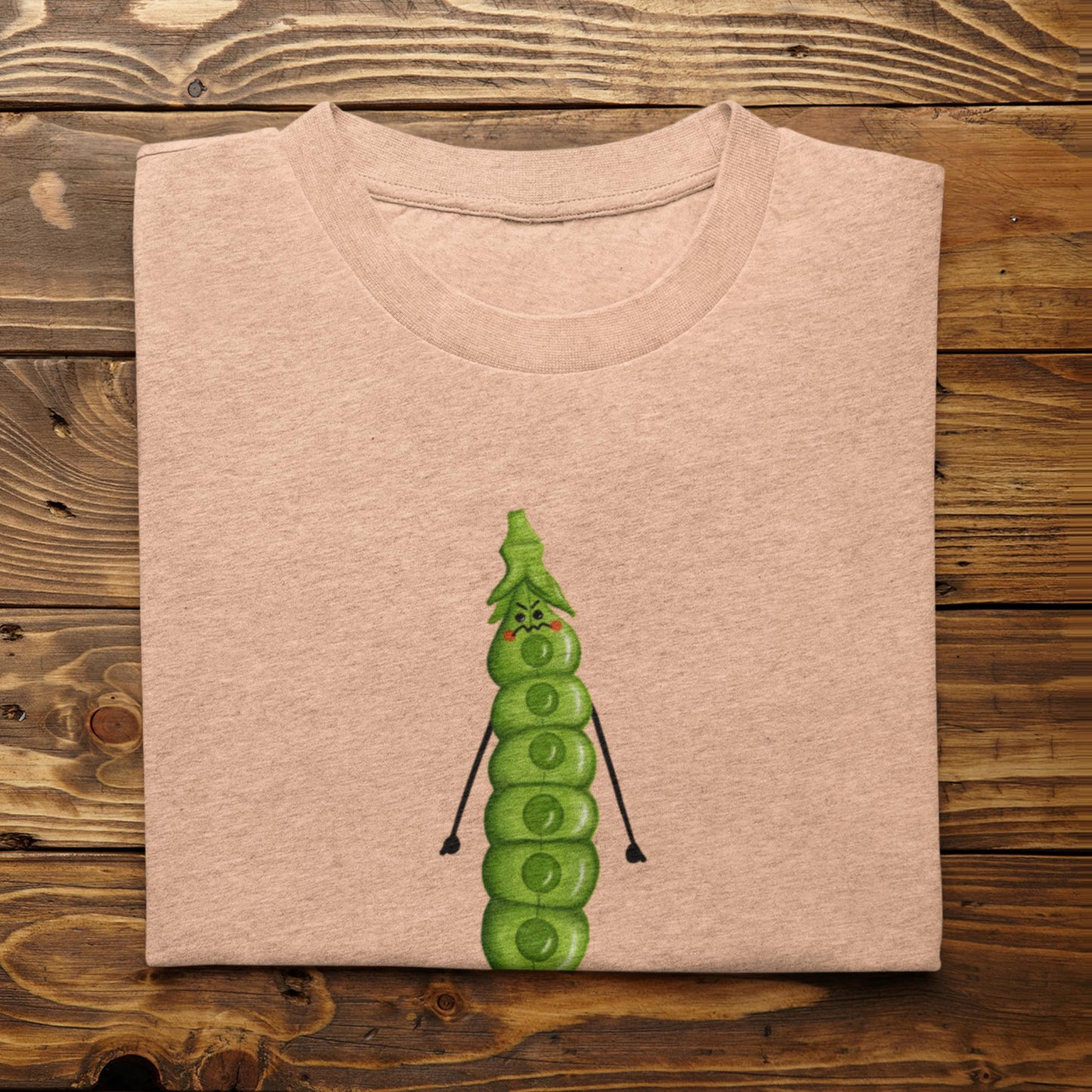Folded heather peach I’m About to Snap gardening t-shirt on rustic wood background