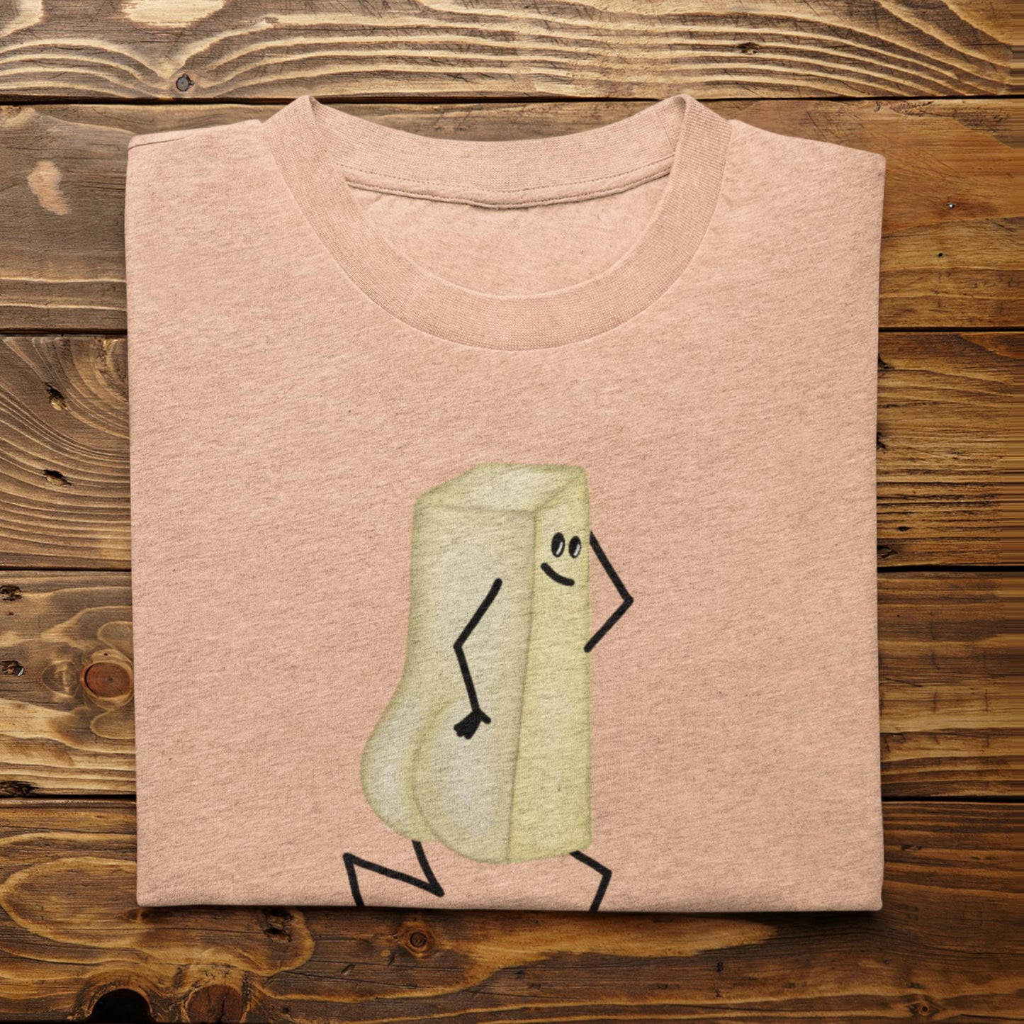 Folded heather peach You Butter Twerk funny butter shirt on rustic wood background