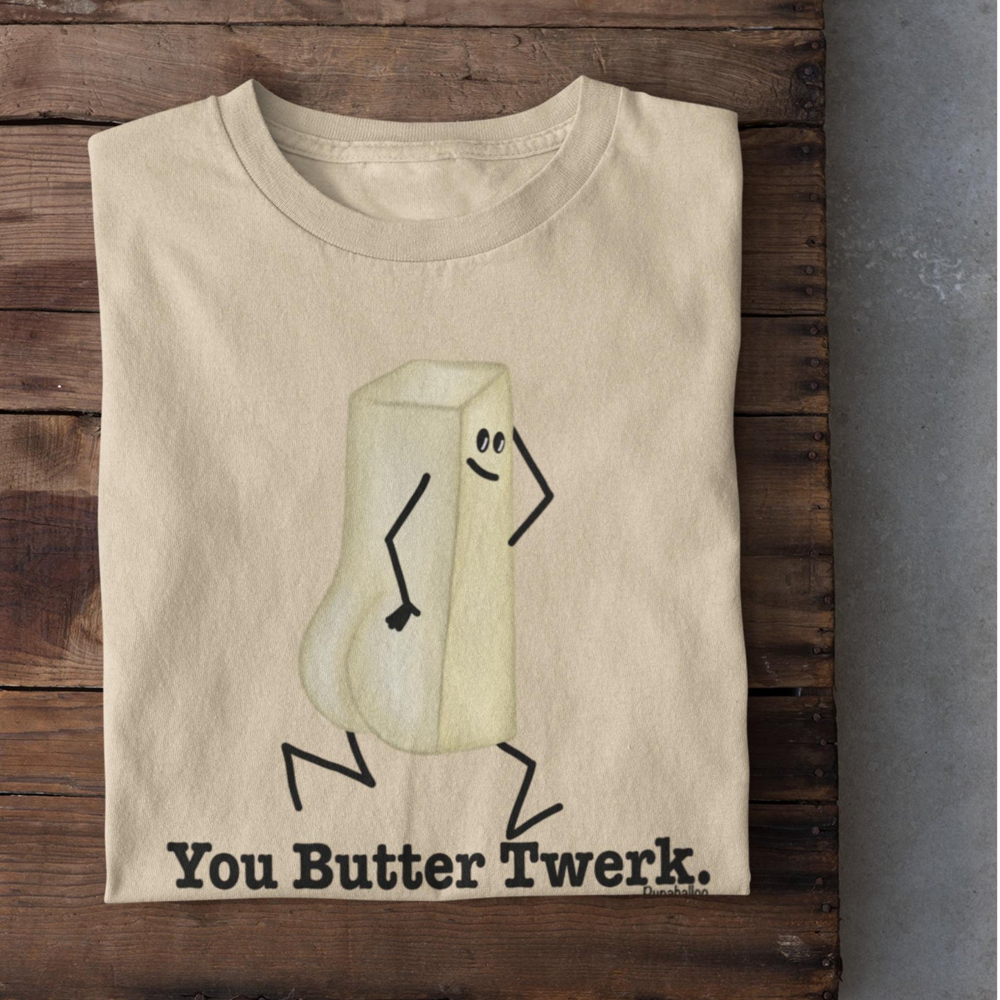 Folded soft cream You Butter Twerk funny food pun shirt on rustic wood background