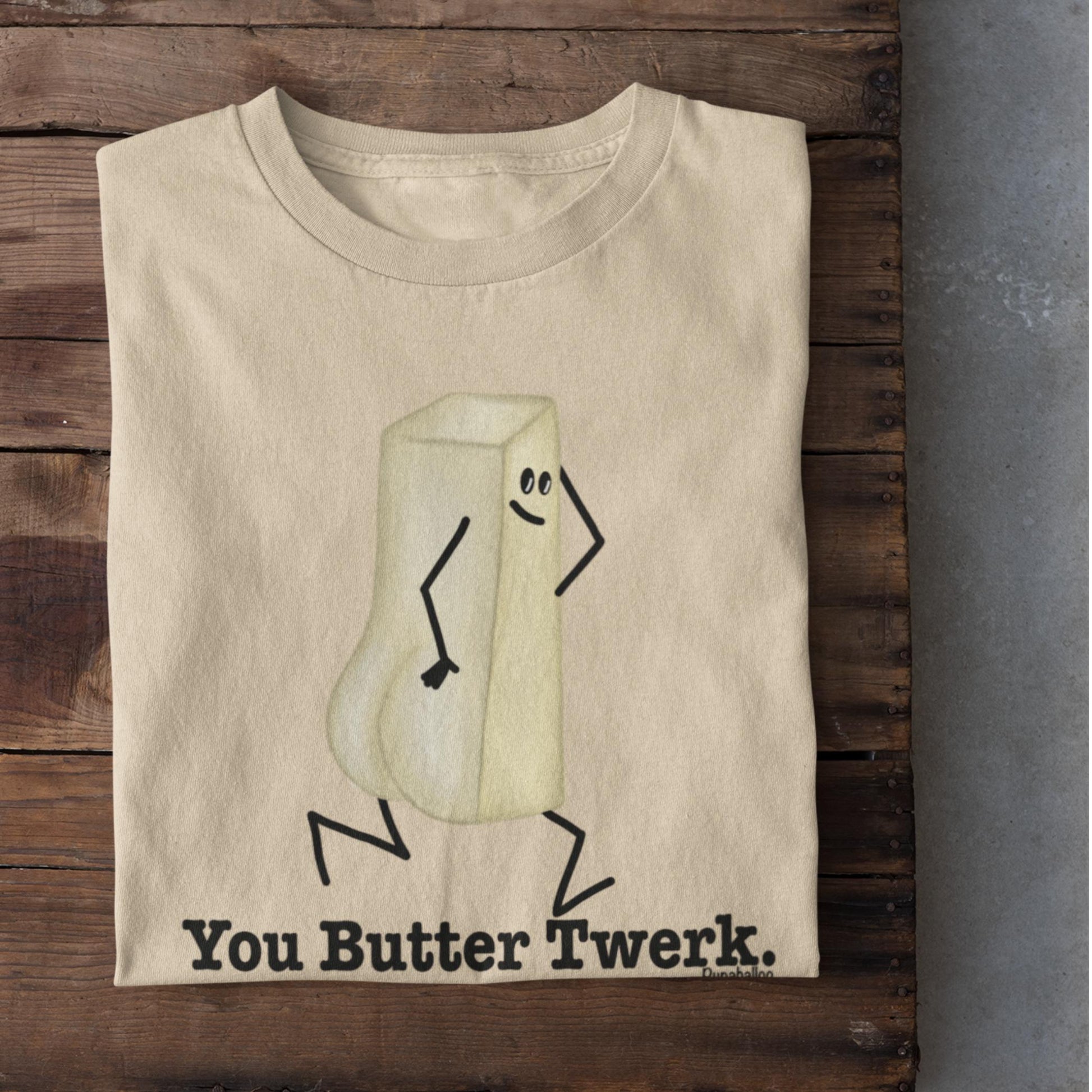 Folded soft cream You Butter Twerk funny food pun shirt on rustic wood background