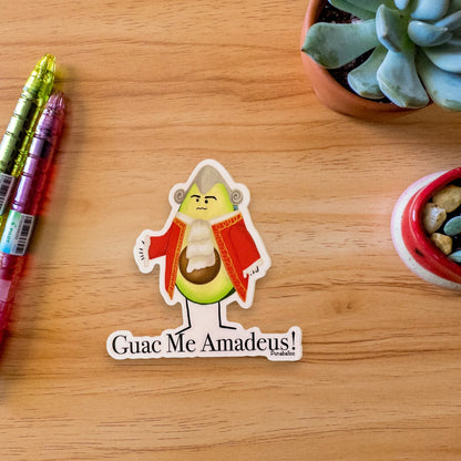 “Guac Me Amadeus” avocado sticker — hand-drawn New Wave food pun design by Punaballoo, waterproof vinyl decal for avocado and music fans.