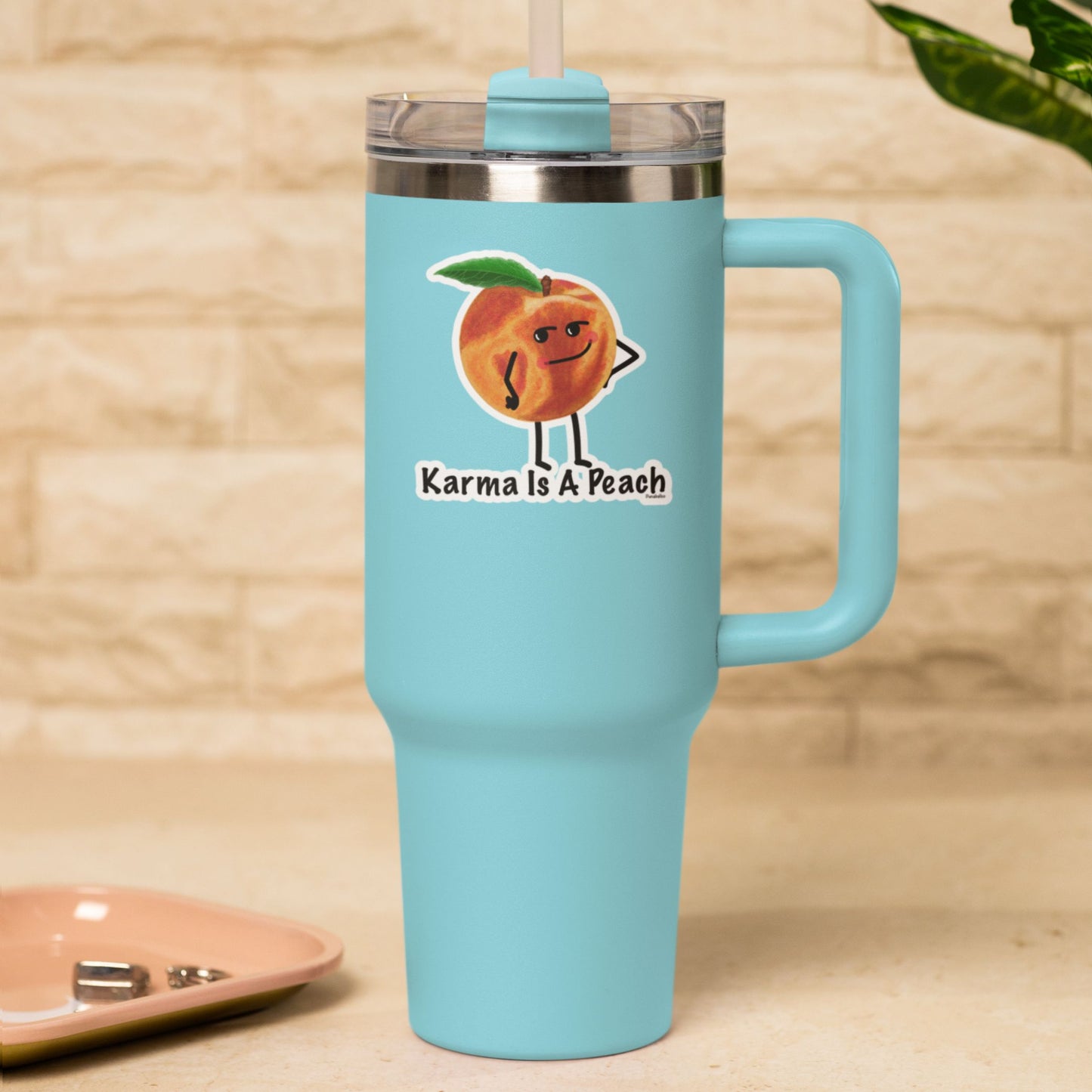 Karma Is a Peach funny fruit sticker on a blue travel tumbler