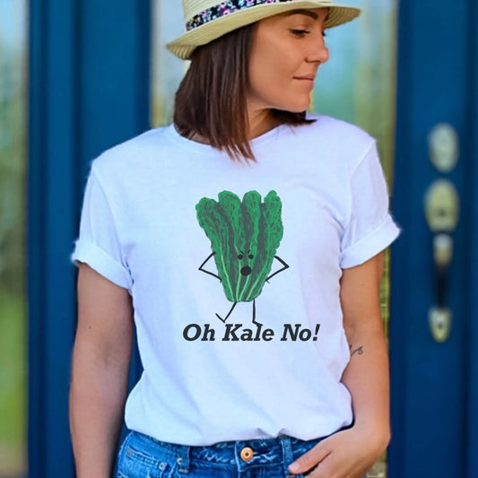 Person wearing a white t-shirt with a green kale graphic and text 'Oh Kale No!' against a blue door background.