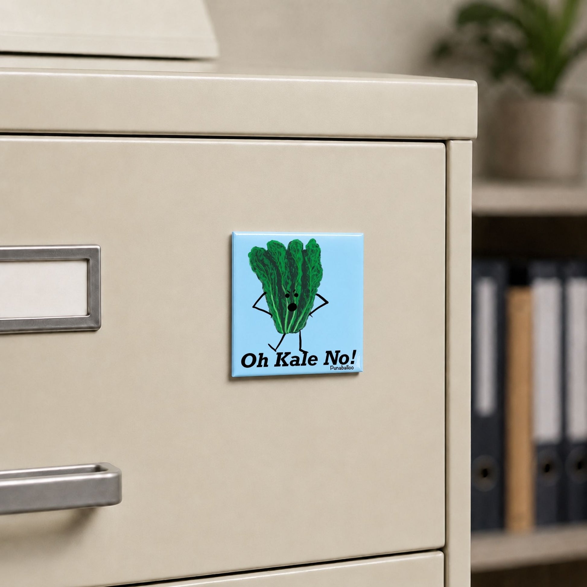 Oh Kale No vegetable pun magnet on a cream file cabinet