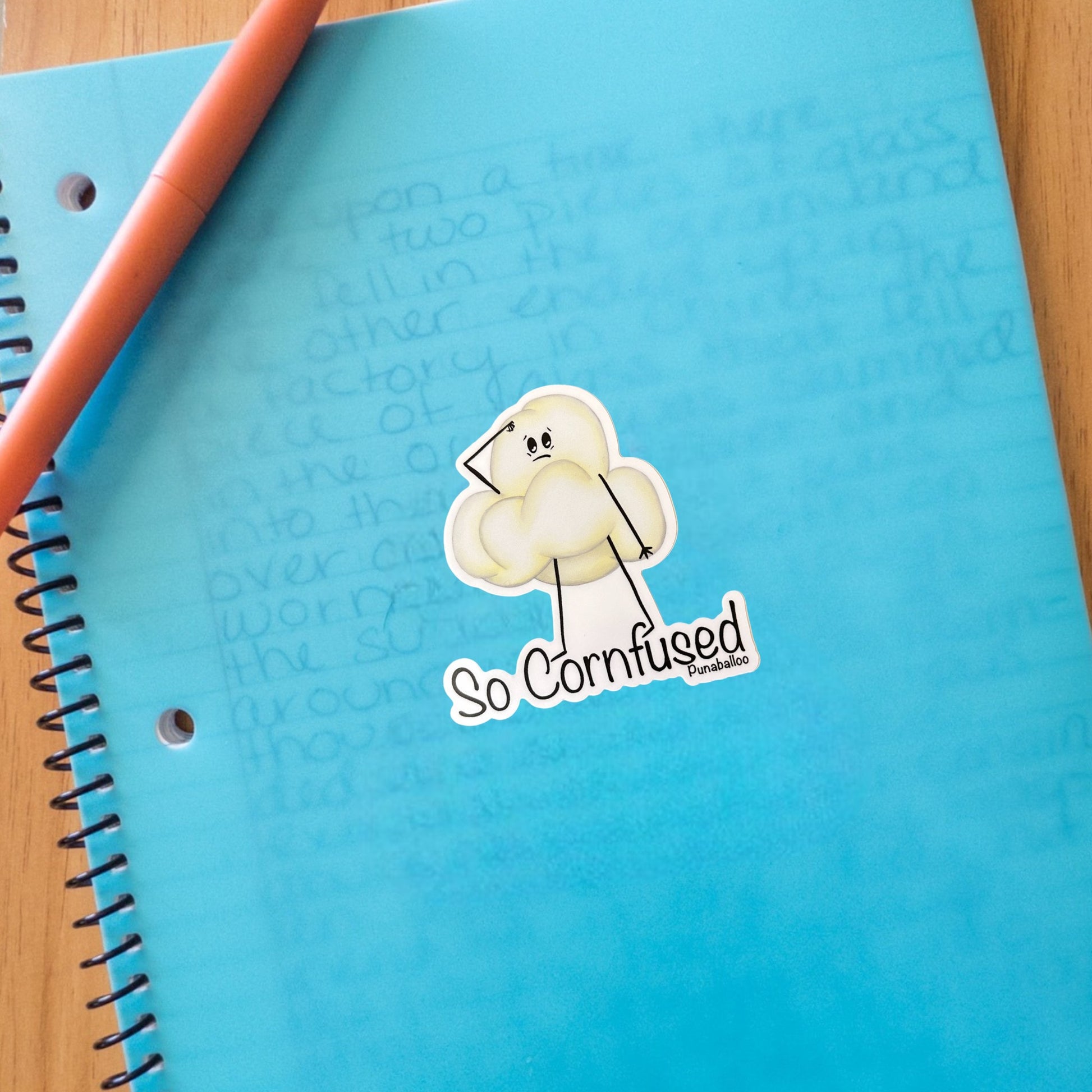 “So Cornfused” popcorn sticker: a funny, hand-drawn pun about brain fog and snack confusion. 🍿 Waterproof vinyl decal for forgetful pun lovers.