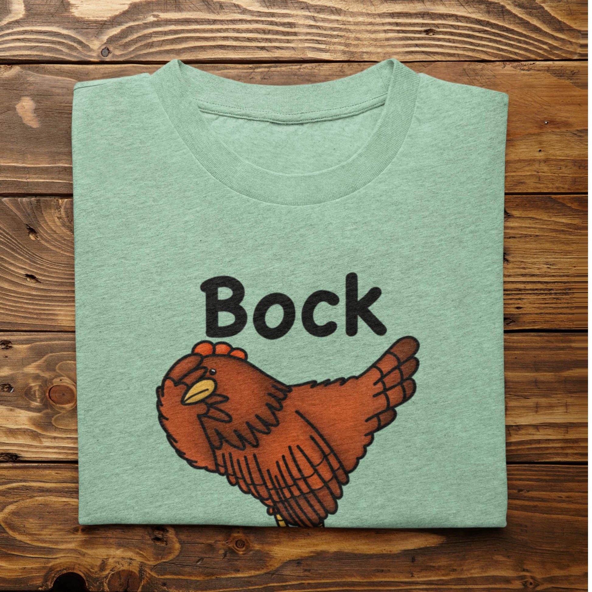 Folded heather mint Bock My Life chicken lover shirt on rustic wood background