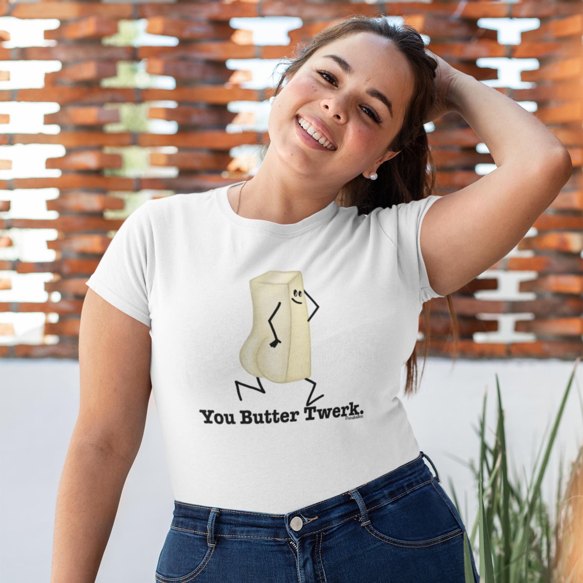  Woman wearing a white You Butter Twerk funny butter t-shirt with jeans