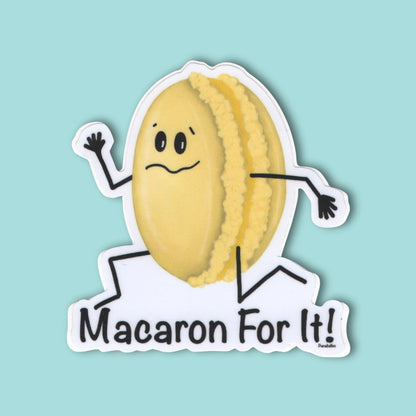 Macaron For It dessert pun sticker featuring a running yellow macaron