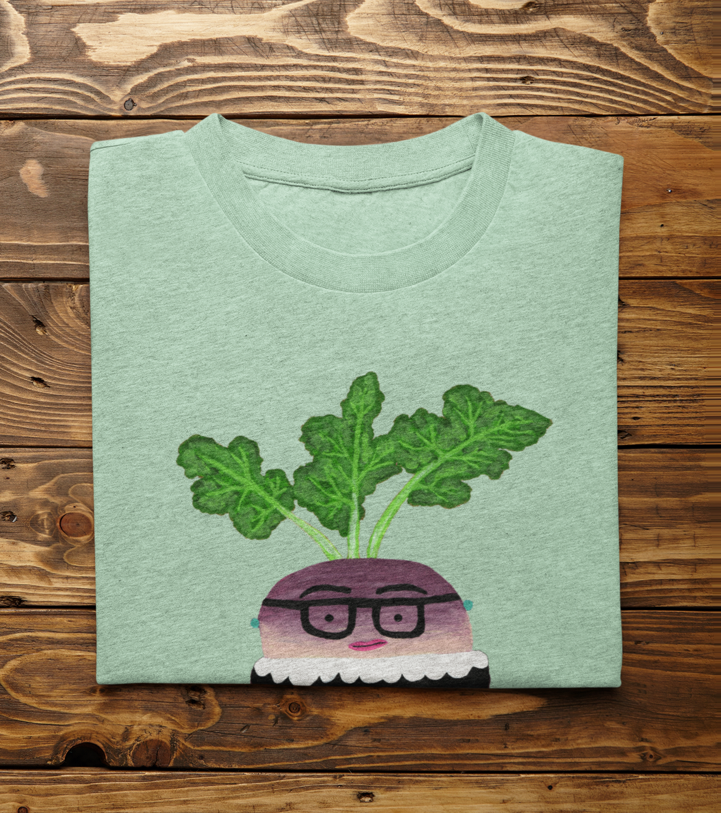 Heather Mint Rutabaga Ginsburg t-shirt folded on wood background