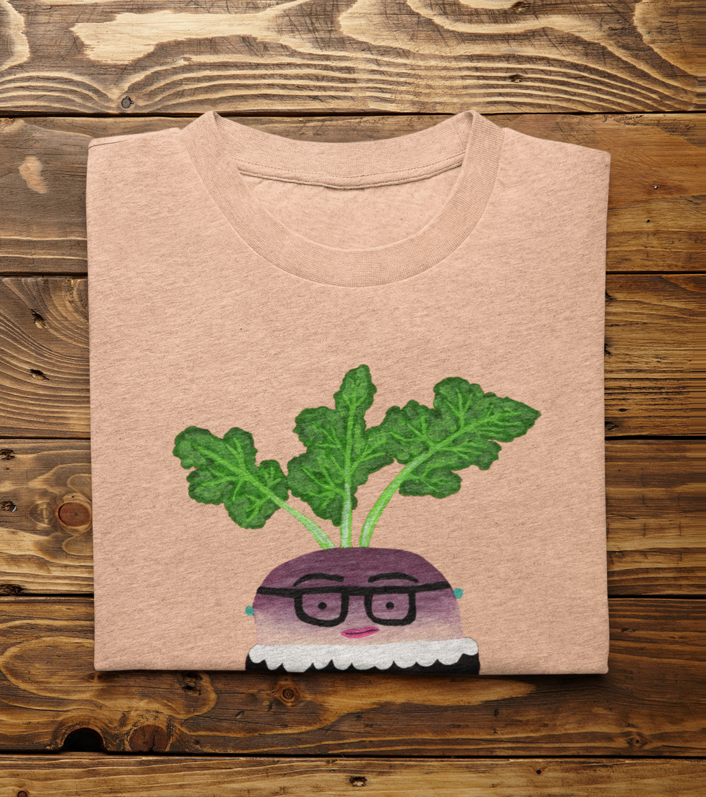 Heather Peach Rutabaga Ginsburg pun shirt folded on wood background