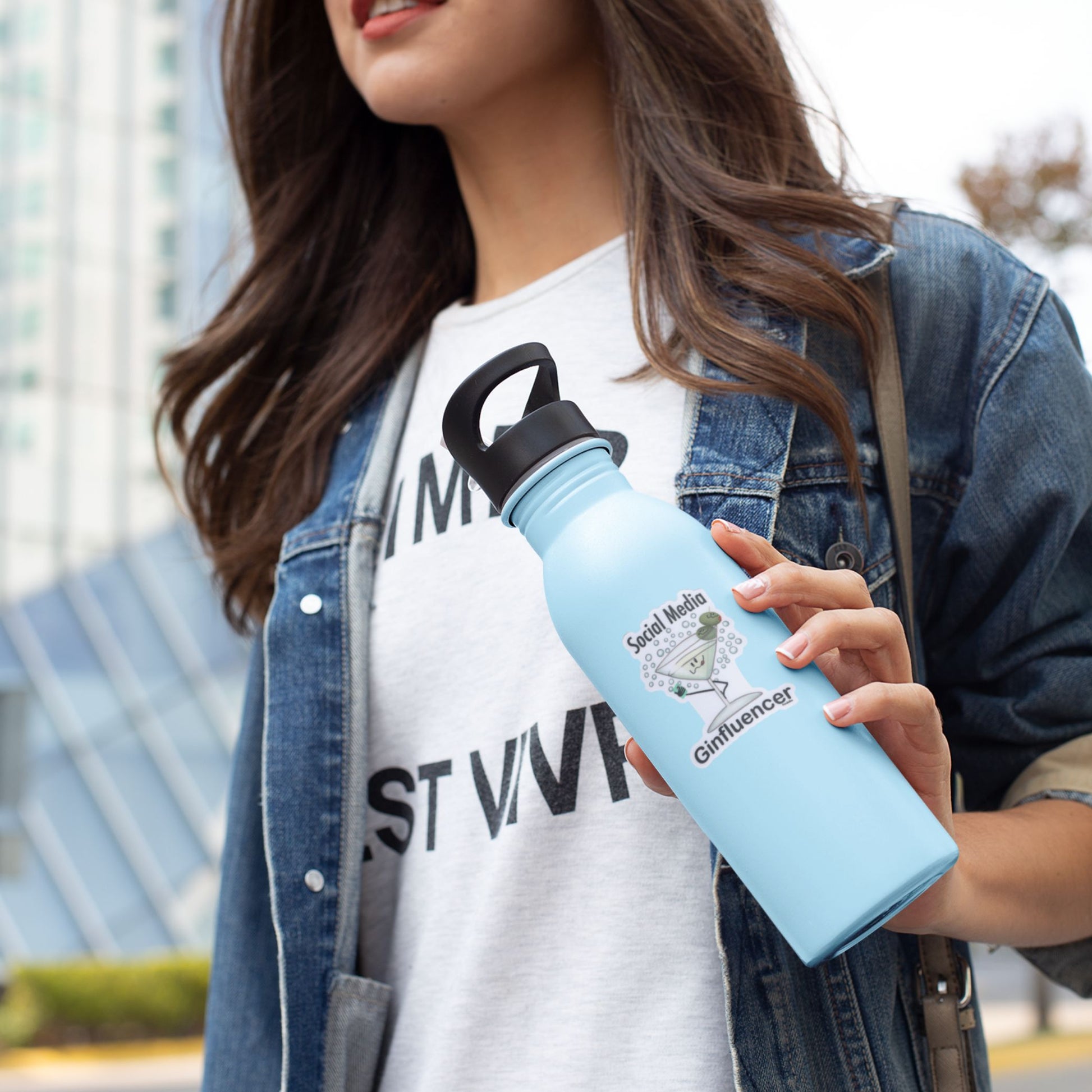 Social Media Ginfluencer Sticker  on a water bottle being held by a woman