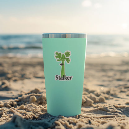 Stalker celery sticker displayed on a mint tumbler at the beach