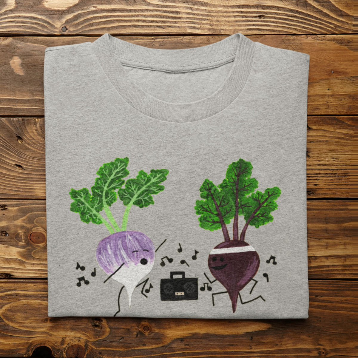 Athletic Heather Turnip the Beet vegetable pun T-shirt folded on a rustic wood background