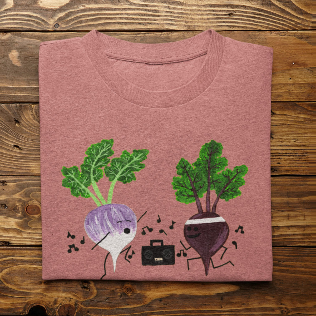 Heather Mauve Turnip the Beet vegetable pun T-shirt folded on a rustic wood background