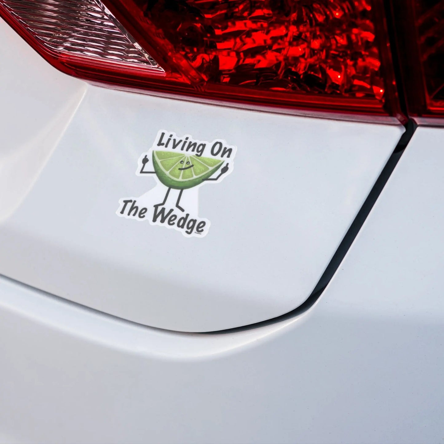 Car bumper with a lime pun sticker and text 'Living On The Wedge'. 