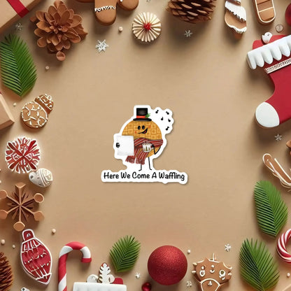 Here We Come A-Waffling sticker — hand-drawn Christmas waffle caroler pun design, waterproof vinyl decal.