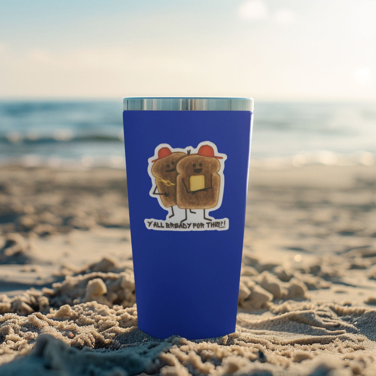 Waterproof bread sticker displayed on a purple tumbler at the beach