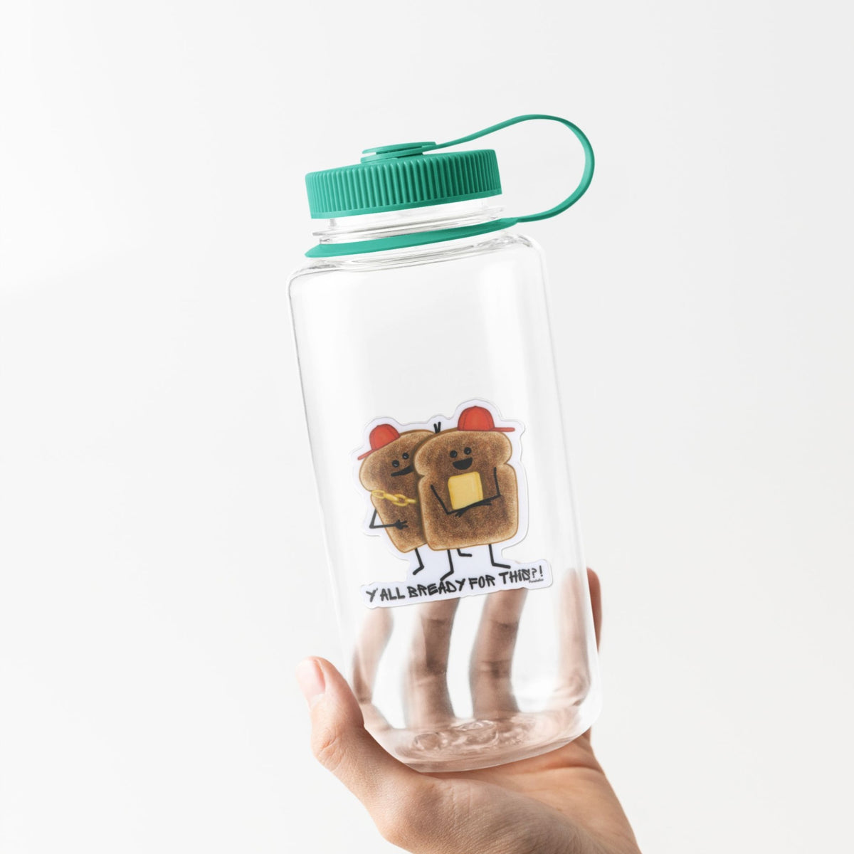 Toast pun sticker displayed on a clear water bottle with a green lid